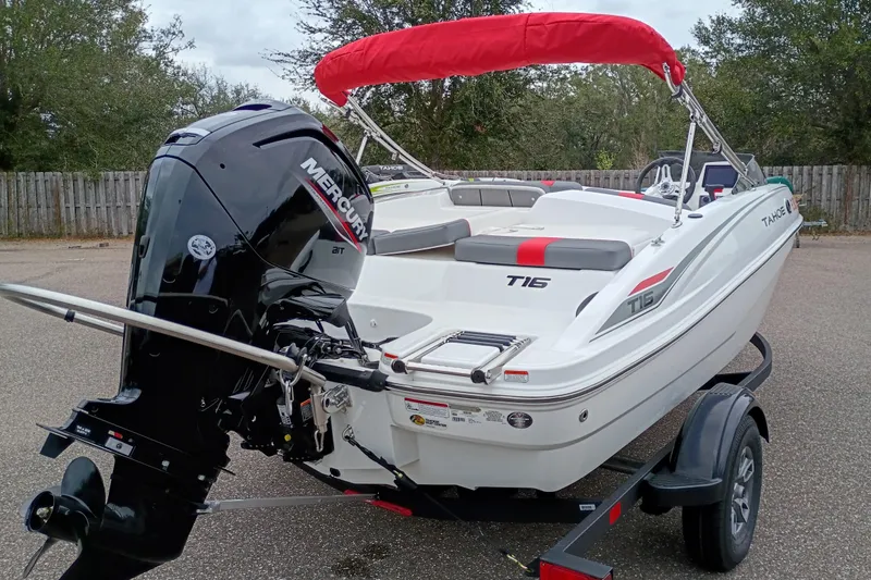 Slide: The Image of 2026 Tahoe T16 boat with Mercury outboard engine and red canopy on trailer. - 4