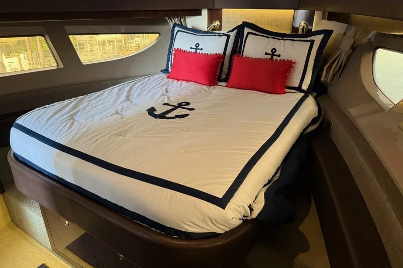 Slide: The Image of Luxurious cabin interior of 2016 Sea Ray Sundancer 400 yacht with nautical-themed bedding. - 10