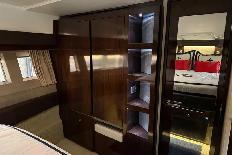 Slide: The Image of Luxurious 2016 Sea Ray Sundancer 400 cabin interior with elegant wood finishes and nautical decor. - 14