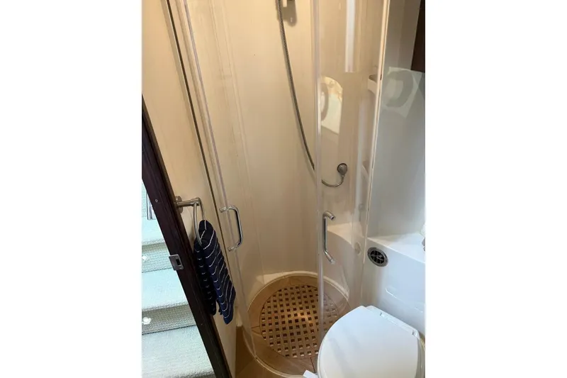 Slide: The Image of Bathroom interior of 2016 Sea Ray Sundancer 400 yacht, featuring shower and toilet. - 15