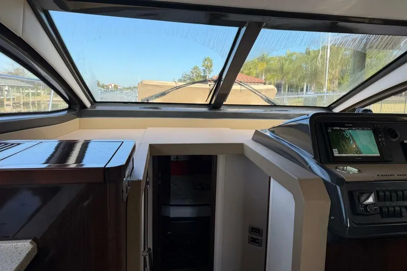 Slide: The Image of Interior view of 2016 Sea Ray Sundancer 400 yacht cockpit with navigation system. - 20