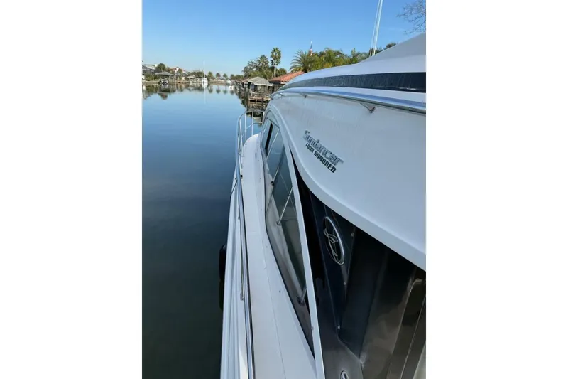 Slide: The Image of 2016 Sea Ray Sundancer 400 yacht on calm water, side view. - 22