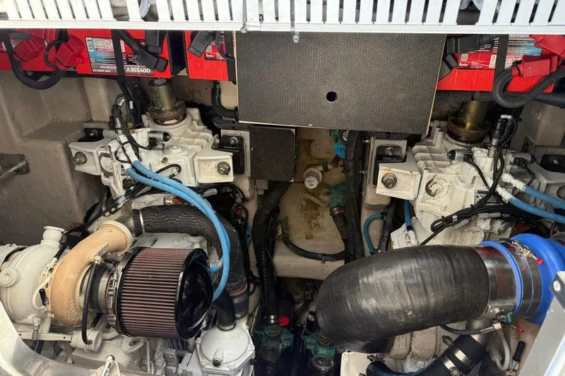 Slide: The Image of Engine compartment of a 2016 Sea Ray Sundancer 400 boat, showcasing mechanical components. - 25