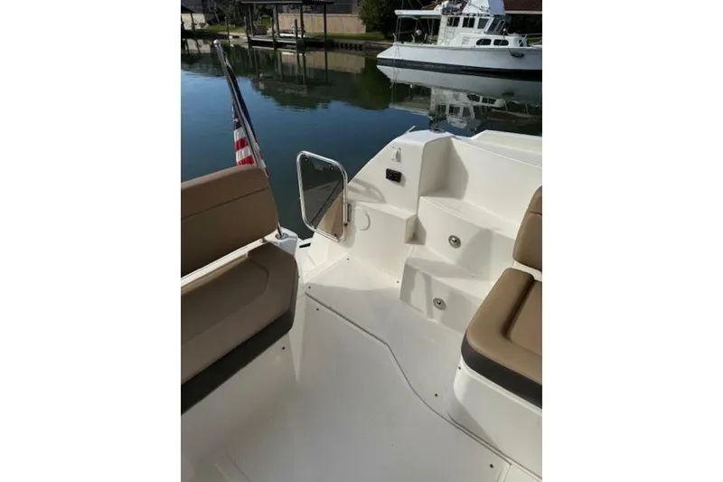Slide: The Image of 2016 Sea Ray Sundancer 400 yacht deck with seating and water view. - 33