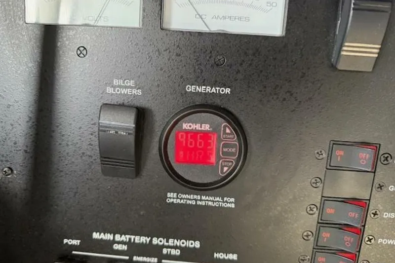 Slide: The Image of Control panel of a 2016 Sea Ray Sundancer 400 with generator display. - 34