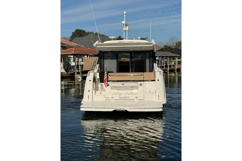 Slide: The Image of 2016 Sea Ray Sundancer 400 yacht docked in a marina, rear view. - 35