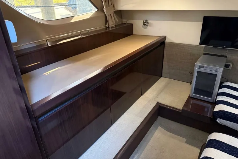 Slide: The Image of Interior of 2016 Sea Ray Sundancer 400 yacht with sleek cabinetry and modern amenities. - 6