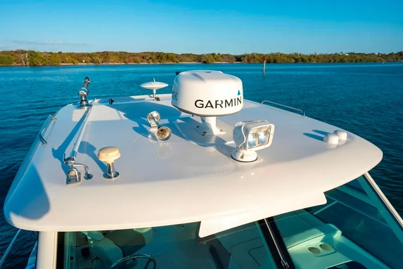Slide: The Image of 2014 Boston Whaler 315 Conquest boat with Garmin radar on calm water. - 24