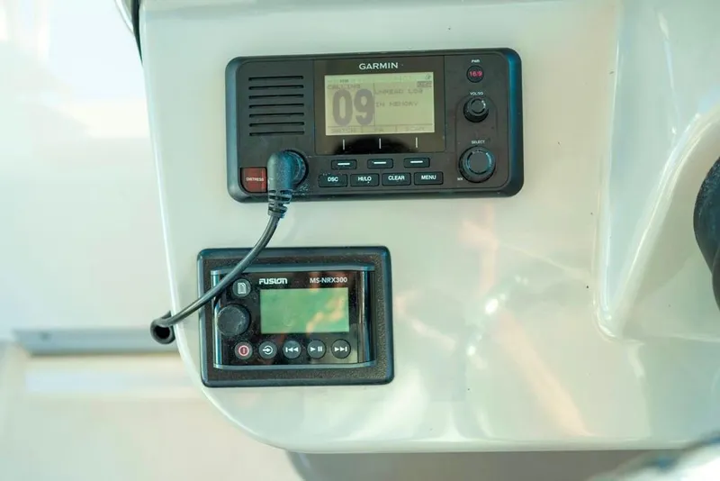 Slide: The Image of Control panel of 2014 Boston Whaler 315 Conquest with Garmin and Fusion devices. - 26