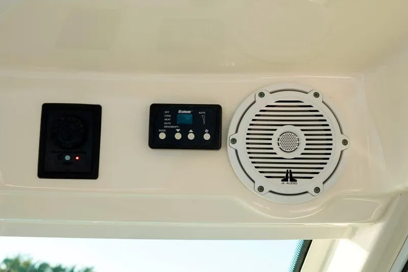 Slide: The Image of 2014 Boston Whaler 315 Conquest interior with JL Audio speaker and control panel. - 27