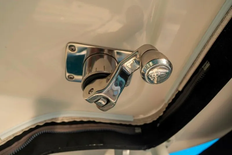 Slide: The Image of Chrome handle on 2014 Boston Whaler 315 Conquest boat interior. - 31