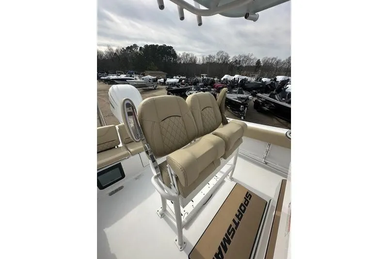 Slide: The Image of 2026 Sportsman Heritage 231 Center Console boat with tan seating and console view. - 20
