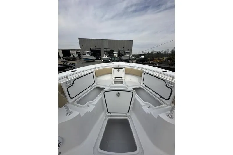 Slide: The Image of 2026 Sportsman Heritage 231 Center Console boat interior with open storage compartments. - 21