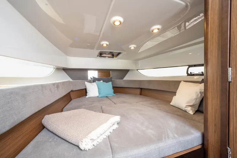 Slide: The Image of 2025 Beneteau Flyer 9 SUNdeck cabin interior with cozy seating and modern lighting. - 13