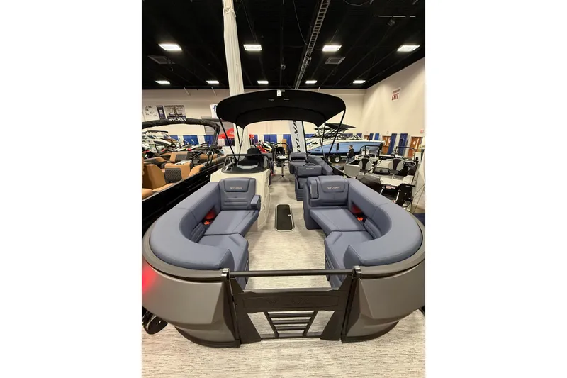 Slide: The Image of 2025 Sylvan G3 SLZ pontoon boat with spacious seating and modern design in showroom. - 4