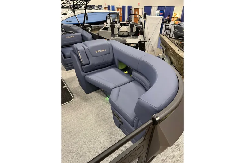 Slide: The Image of 2025 Sylvan G3 SLZ boat interior with luxurious blue seating. - 6