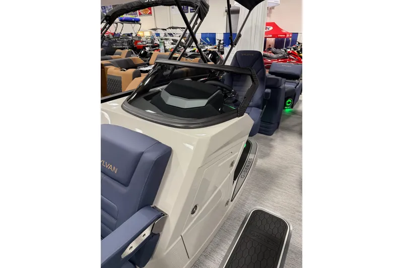 Slide: The Image of 2025 Sylvan G3 SLZ boat interior with modern seating and sleek dashboard design. - 8