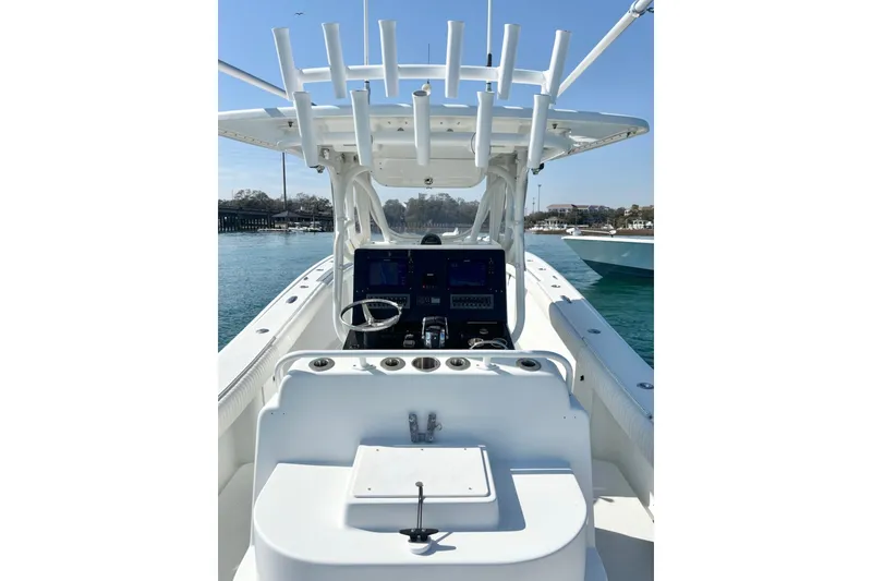 Slide: The Image of 2007 Yellowfin 36 Offshore boat cockpit with steering wheel and navigation equipment. - 14