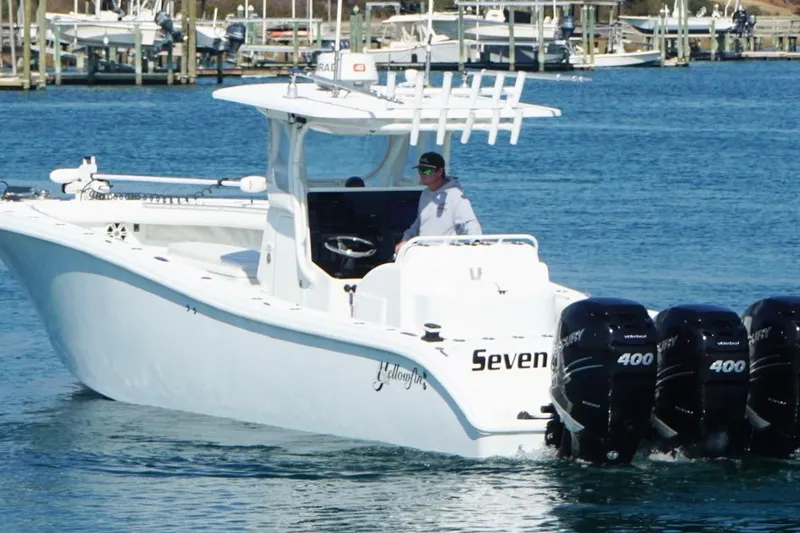 Slide: The Image of 2007 Yellowfin 36 Offshore boat with multiple outboard engines on the water. - 4