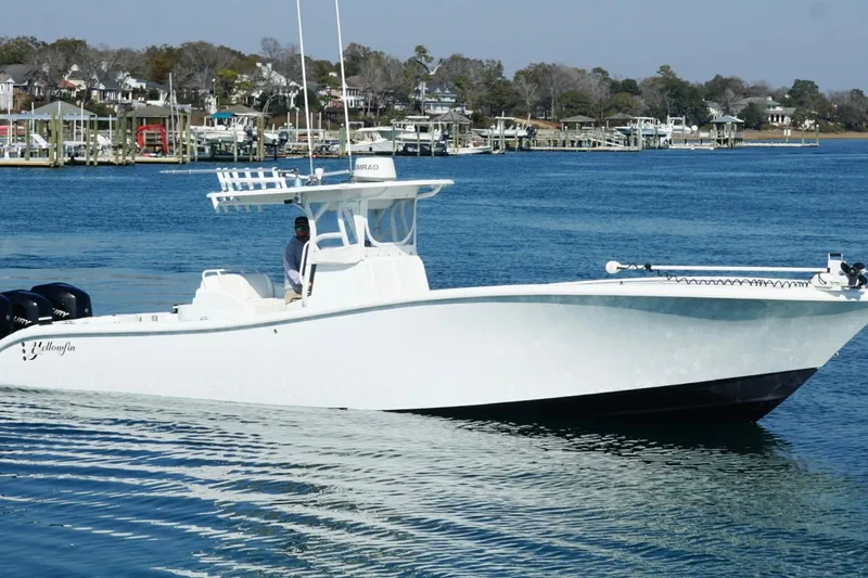 Slide: The Image of 2007 Yellowfin 36 Offshore boat cruising on a calm blue waterway. - 8