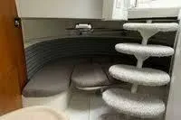 Slide: The Image of Interior of 1995 Silverton 361 Express yacht with curved seating and spiral staircase. - 6