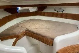 Slide: The Image of 1995 Silverton 361 Express cabin interior with brown and white seating. - 8