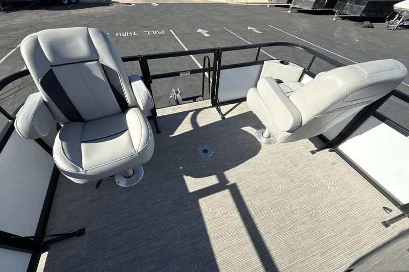 Slide: The Image of 2023 Viaggio Del Mar 18F boat interior with two gray seats on deck. - 11