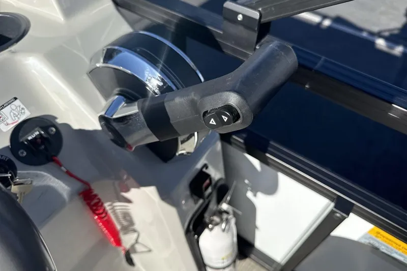 Slide: The Image of Control panel of 2023 Viaggio Del Mar 18F boat with throttle lever and safety features. - 16