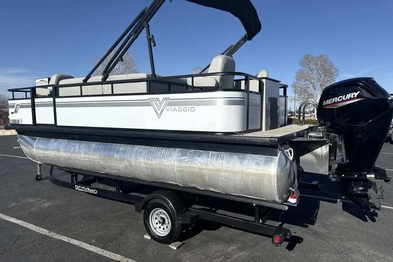 Slide: The Image of 2023 Viaggio Del Mar 18F pontoon boat on trailer with Mercury outboard motor. - 3