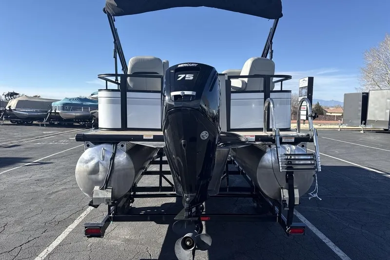 Slide: The Image of 2023 Viaggio Del Mar 18F pontoon boat with Mercury 75 engine, parked outdoors. - 4