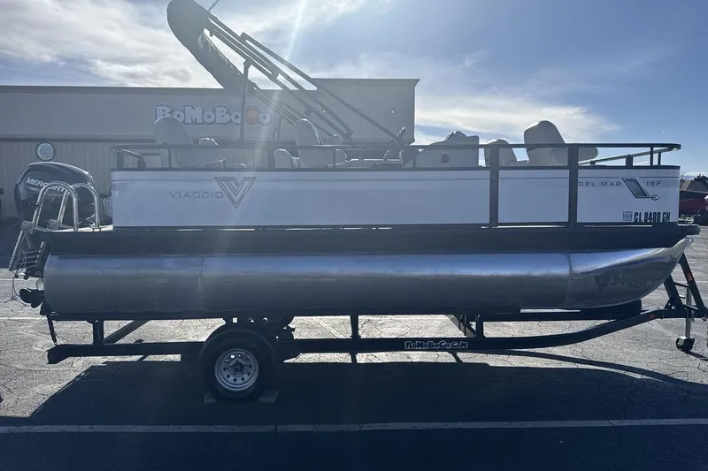 Slide: The Image of 2023 Viaggio Del Mar 18F pontoon boat on trailer, parked outdoors. - 6
