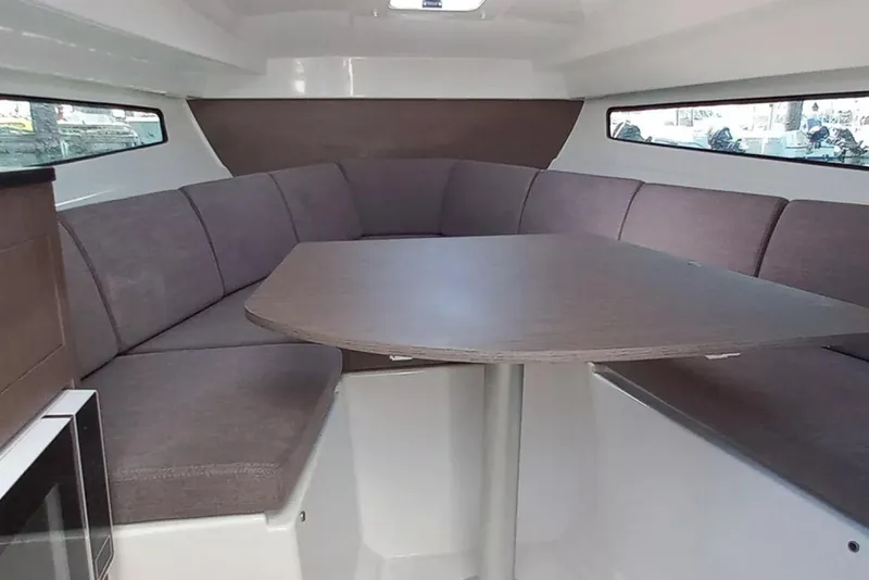 Slide: The Image of 2026 Beneteau Flyer 8 SUNdeck interior with cozy seating and table. - 8
