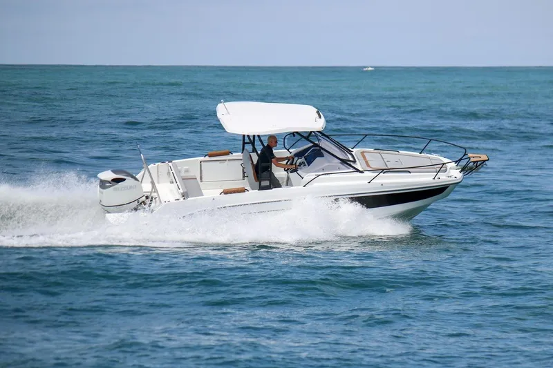 Slide: The Image of 2026 Beneteau Flyer 8 SUNdeck cruising on open water, showcasing sleek design and performance. - 9