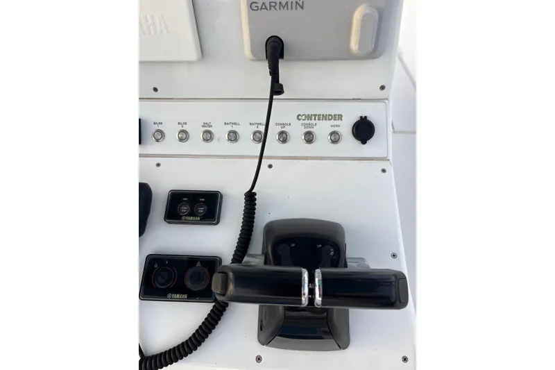 Slide: The Image of Control panel of a 2001 Contender 31 Open boat with Yamaha and Garmin equipment. - 14