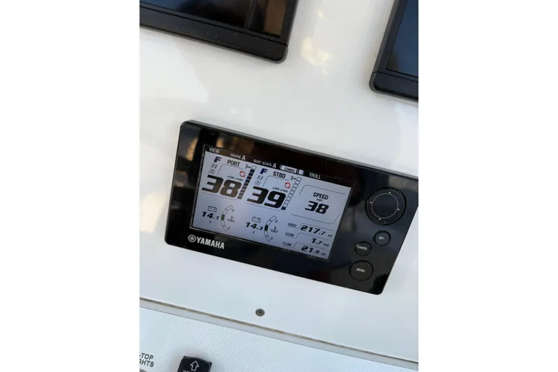 Slide: The Image of Yamaha display on 2001 Contender 31 Open boat dashboard showing speed and engine data. - 15