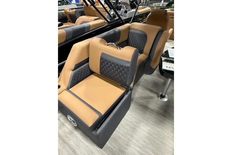 Slide: The Image of Luxurious interior seating of 2026 Sylvan L3 LZ DH boat with tan and gray upholstery. - 11