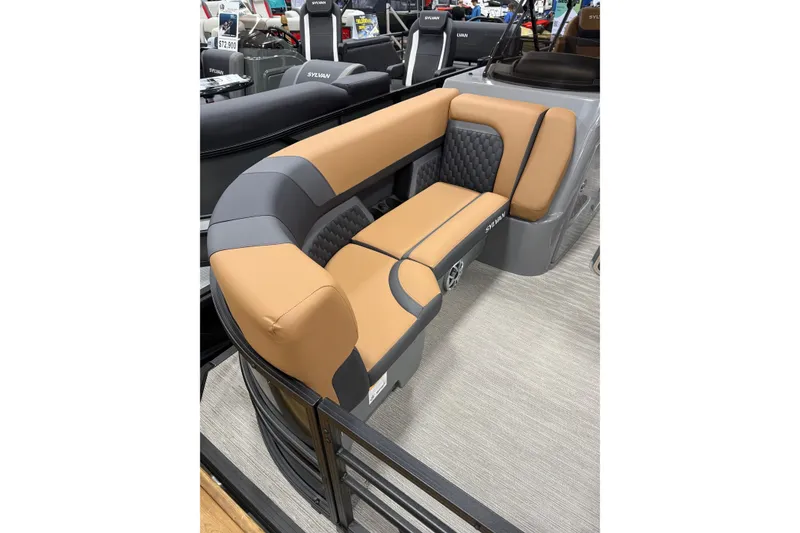 Slide: The Image of 2026 Sylvan L3 LZ DH boat interior with tan and gray seating. - 2