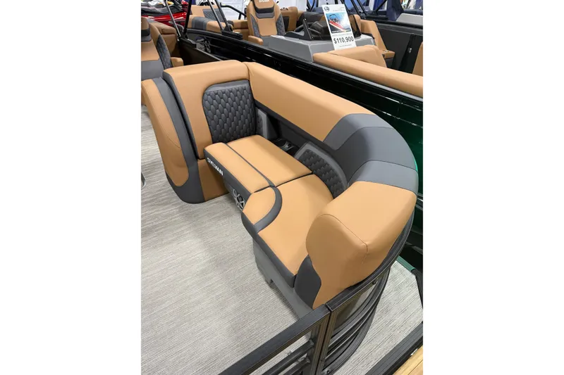 Slide: The Image of Luxurious seating on 2026 Sylvan L3 LZ DH pontoon boat, featuring tan and gray upholstery. - 3