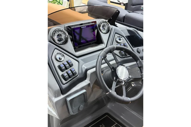 Slide: The Image of 2026 Sylvan L3 LZ DH boat dashboard with steering wheel and digital display. - 8