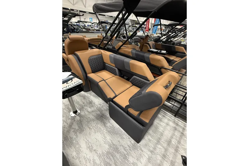 Slide: The Image of 2026 Sylvan L3 SLZ boat interior with luxurious tan and gray seating. - 12