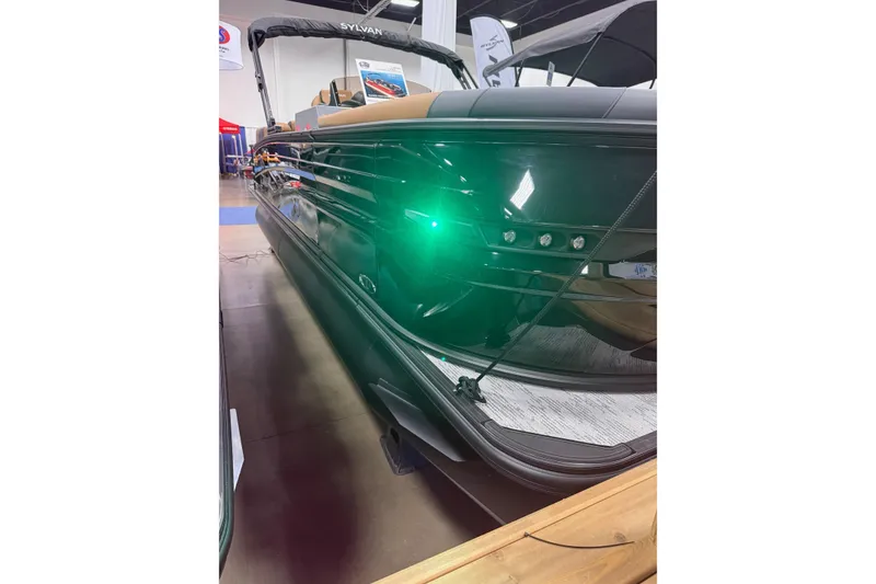 Slide: The Image of 2026 Sylvan L3 SLZ pontoon boat with sleek design and green LED lights. - 14