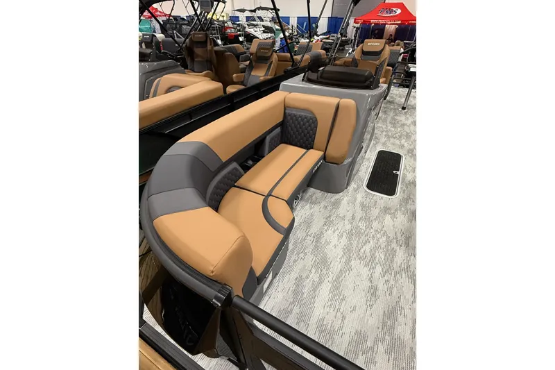 Slide: The Image of 2026 Sylvan L3 SLZ boat interior with tan and gray seating, modern design. - 2
