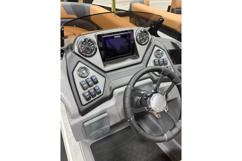 Slide: The Image of 2026 Sylvan L3 SLZ boat dashboard with steering wheel, gauges, and control panel. - 7