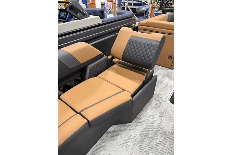 Slide: The Image of 2026 Sylvan L3 SLZ boat interior with luxurious tan and black seating. - 8
