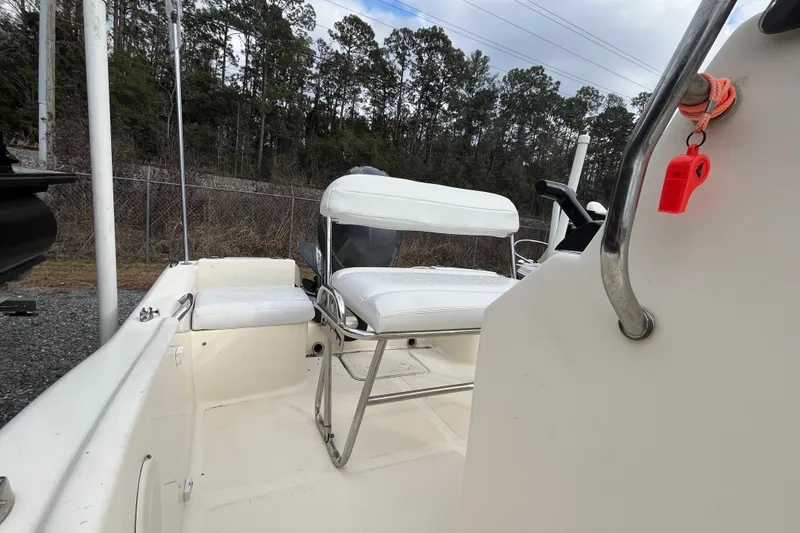 Slide: The Image of 2019 Scout 175 Sportfish boat interior with white seating and control panel. - 10