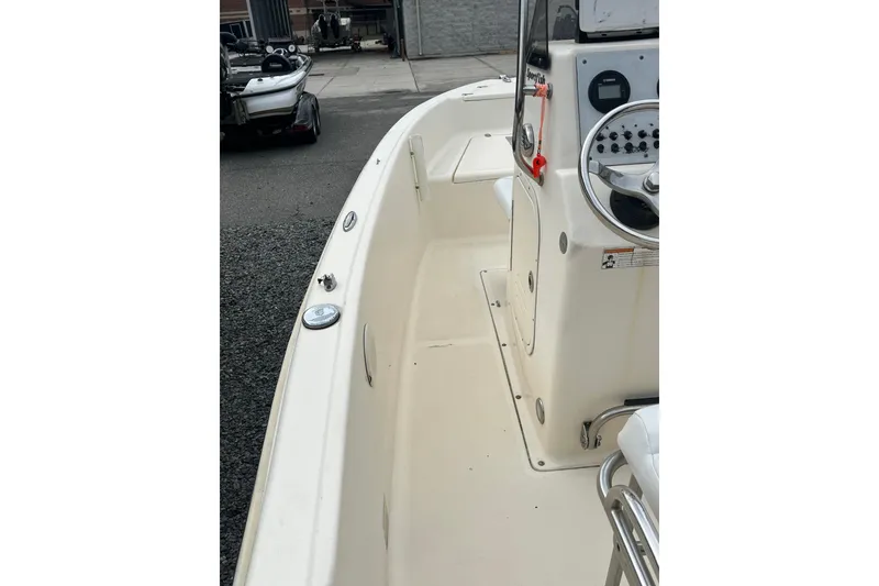 Slide: The Image of 2019 Scout 175 Sportfish boat interior with steering console and seating. - 2