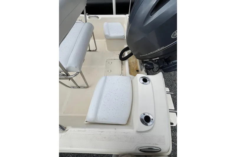 Slide: The Image of 2019 Scout 175 Sportfish boat interior with seating and outboard motor. - 3