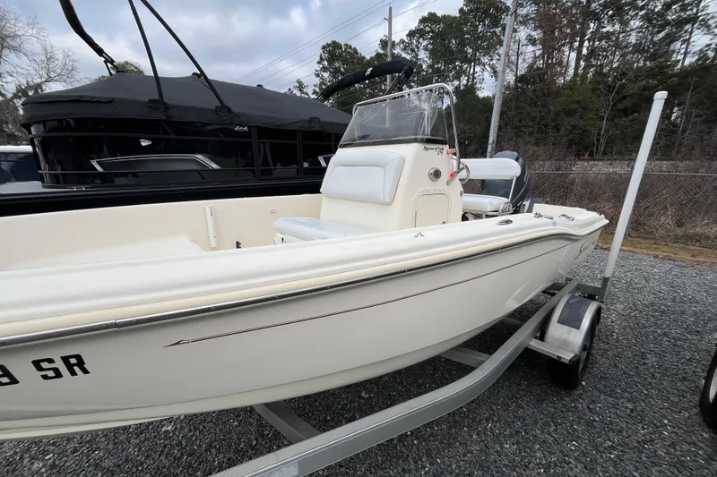 Slide: The Image of 2019 Scout 175 Sportfish boat on trailer, parked outdoors. - 4