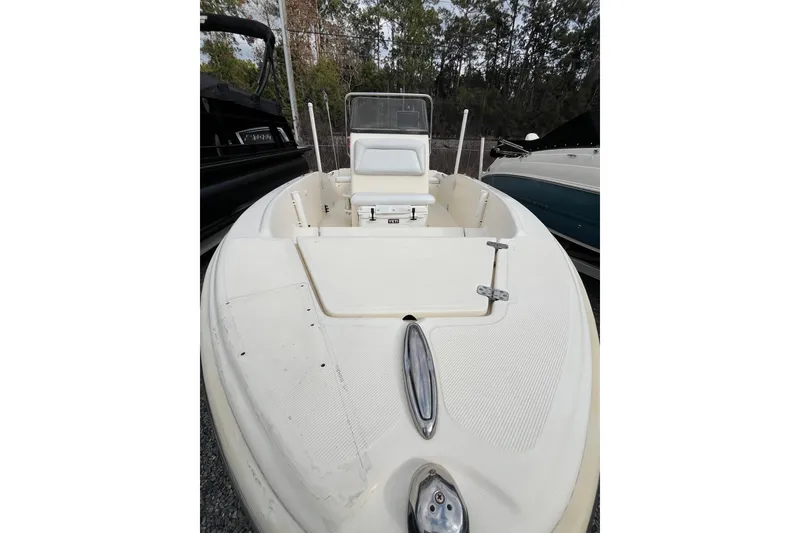 Slide: The Image of 2019 Scout 175 Sportfish boat with white deck, parked outdoors. - 6