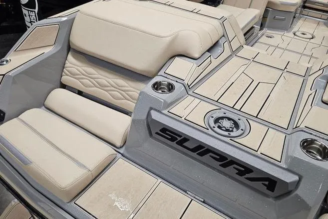 Slide: The Image of 2026 Supra SL boat interior with beige seating and modern design elements. - 12